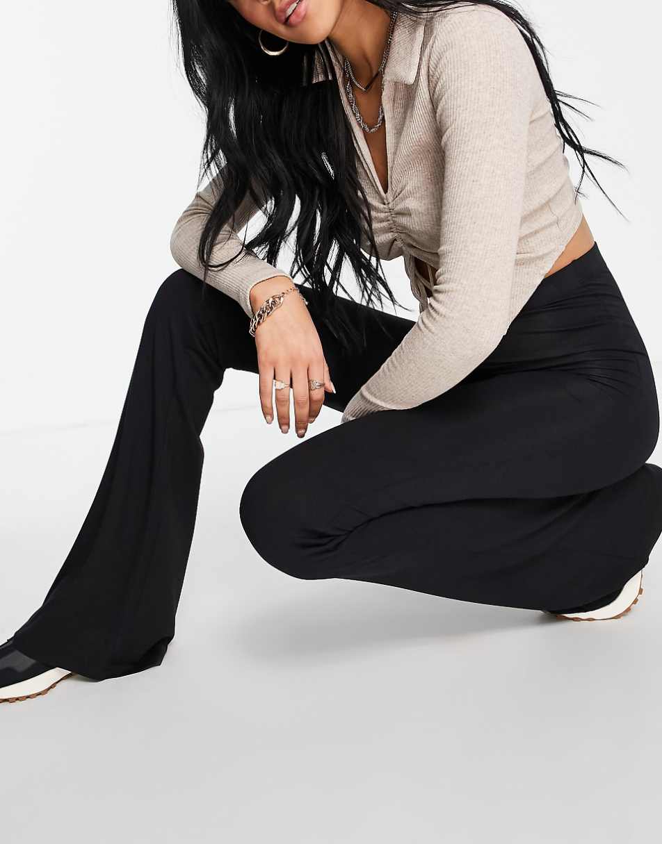 ASOS DESIGN Tall kick flare pants in black