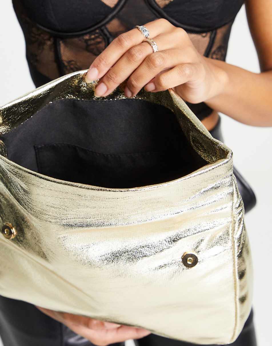 ASOS DESIGN roll top clutch bag in gold