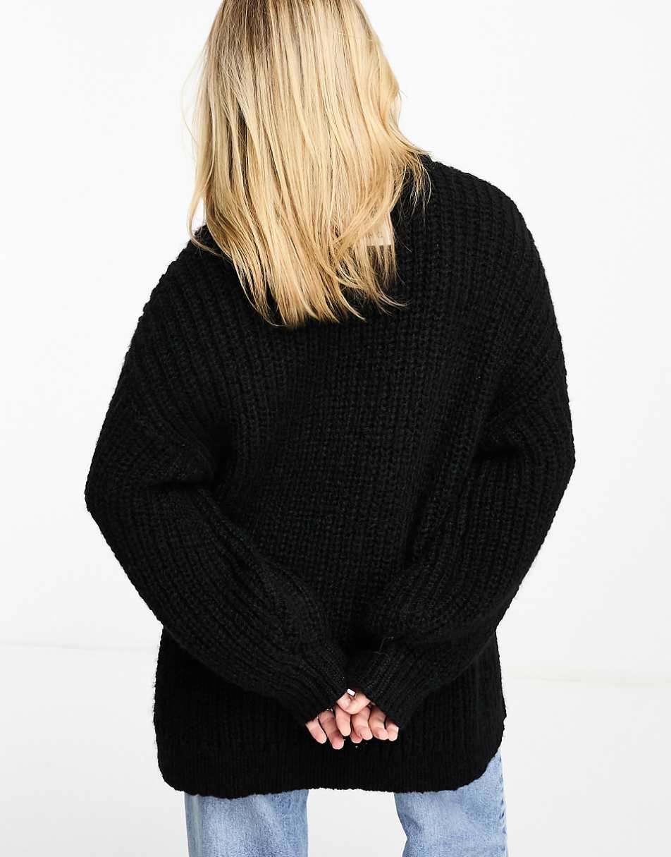 Monki high neck chunky rib knitted sweater with volume sleeve in black
