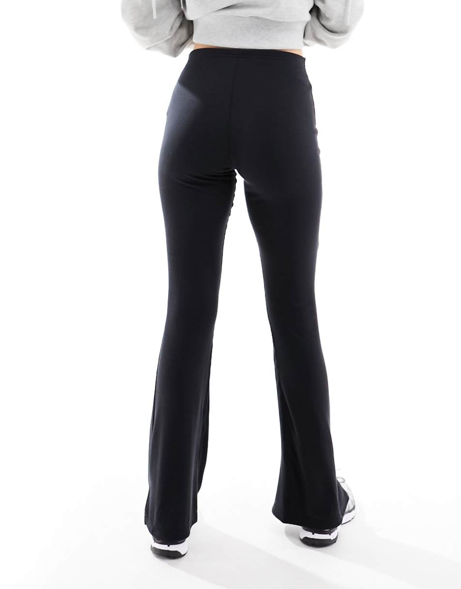 Nike ribbed mid rise flared pants in black