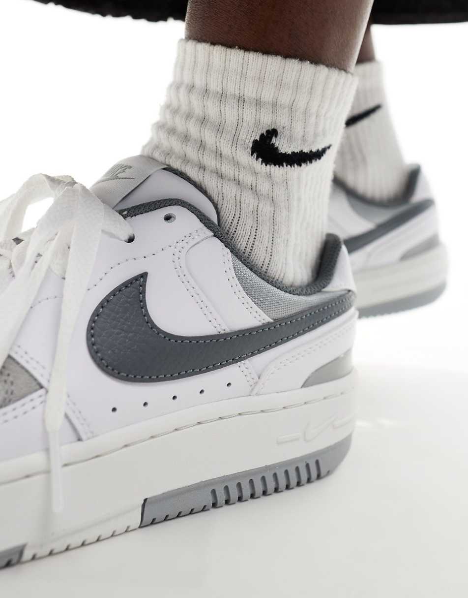Nike Gamma Force sneakers in white and gray