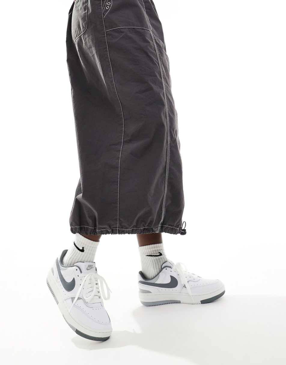 Nike Gamma Force sneakers in white and gray