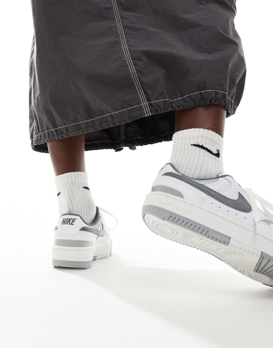 Nike Gamma Force sneakers in white and gray
