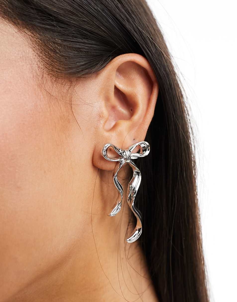 ASOS DESIGN stud earrings with bow design silver tone