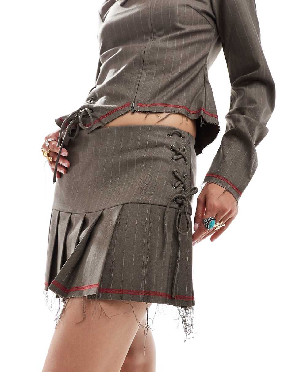 COLLUSION pleated mini skirt with lace up detail and raw hem - part of a set
