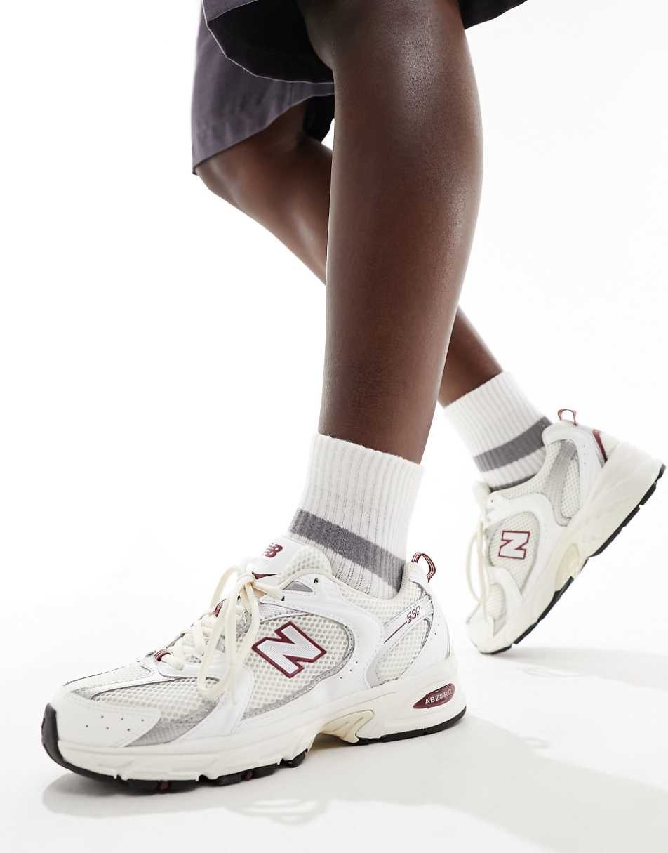 New Balance 530 sneakers in white with red and gray details