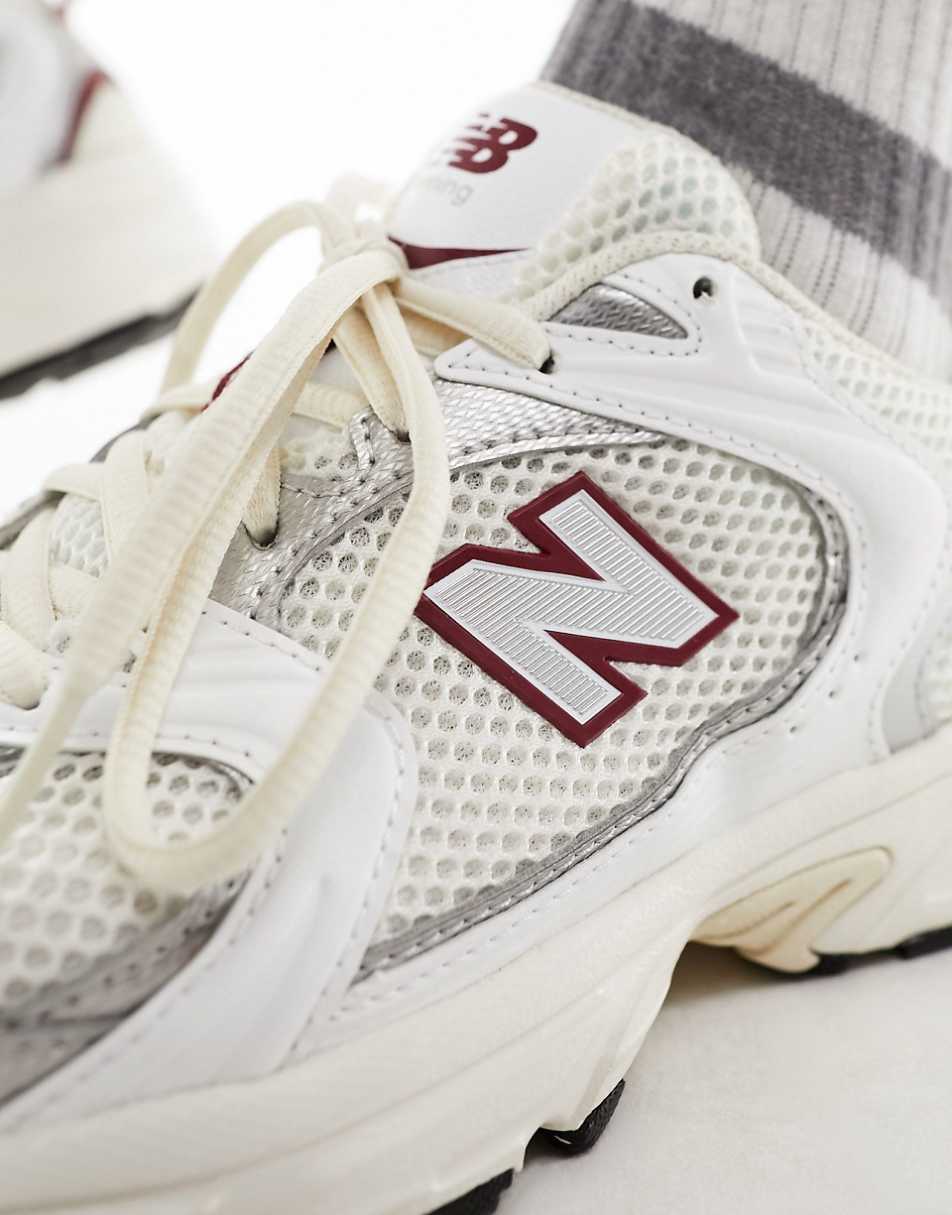 New Balance 530 sneakers in white with red and gray details