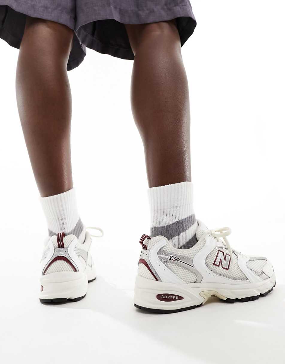 New Balance 530 sneakers in white with red and gray details