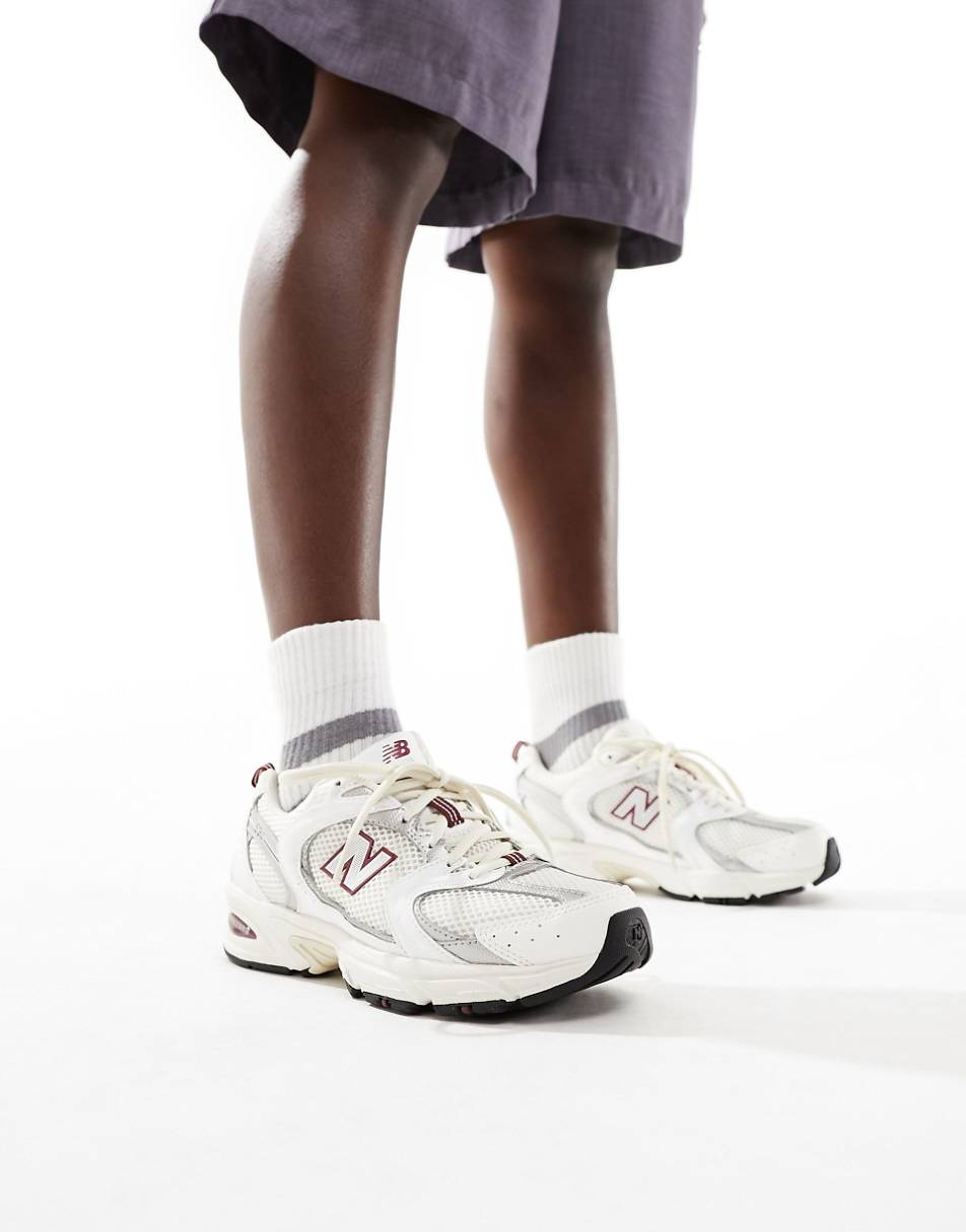 New Balance 530 sneakers in white with red and gray details