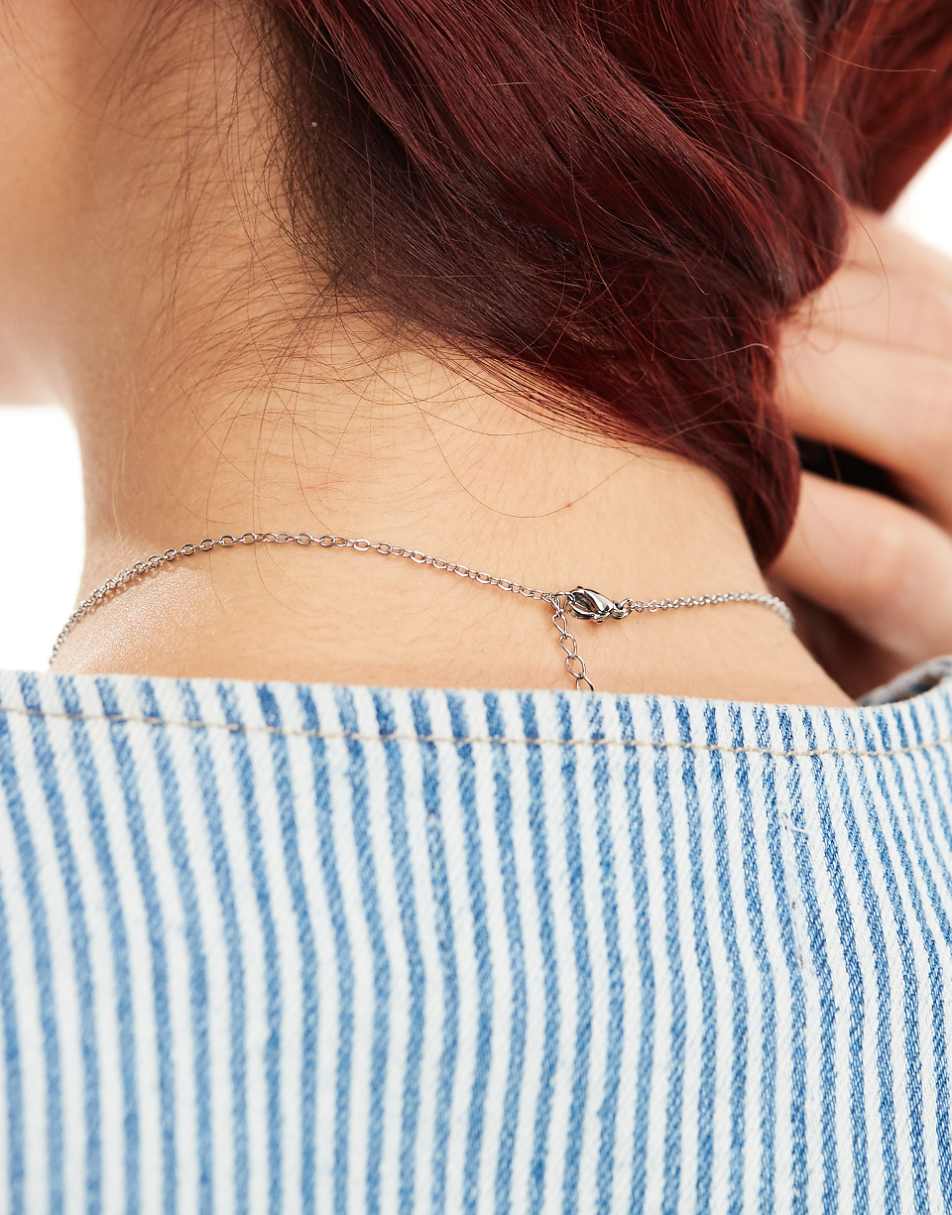 Lost Souls stainless steel bow pendant necklace in silver