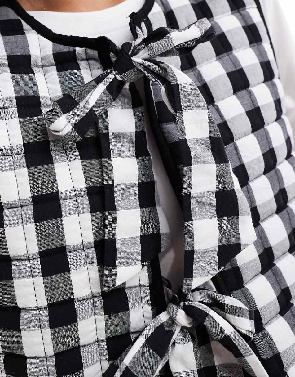 ASOS DESIGN quilted vest with bows in mono gingham