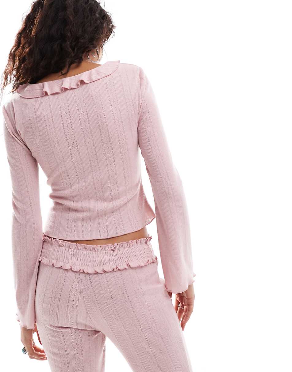 Kiss The Sky ruffle pointelle blouse in pink