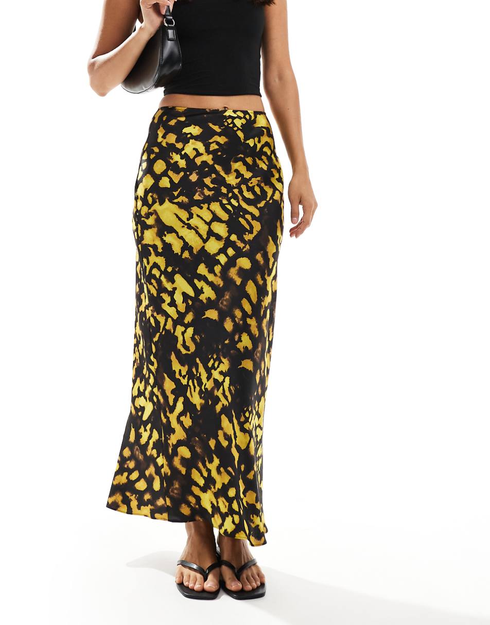 ASOS DESIGN satin bias cut midi skirt in yellow and black splotch print