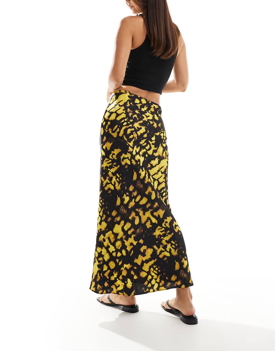 ASOS DESIGN satin bias cut midi skirt in yellow and black splotch print