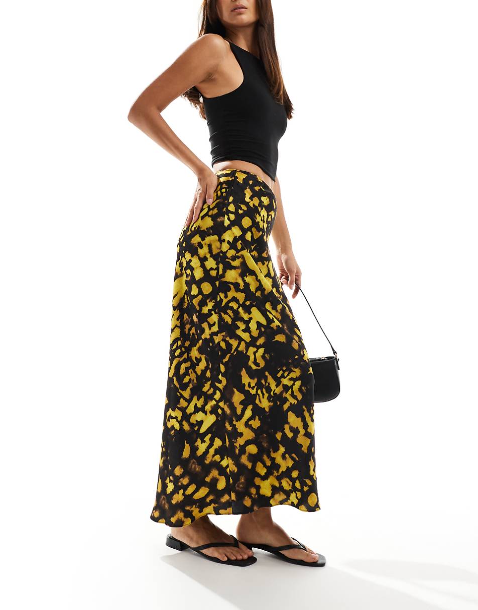 ASOS DESIGN satin bias cut midi skirt in yellow and black splotch print