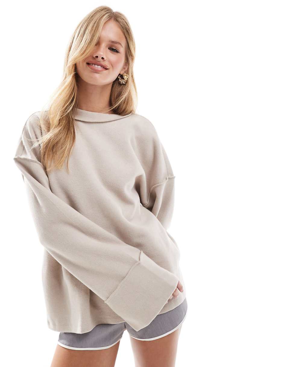 ASOS DESIGN supersoft exposed seam sweatshirt with deep cuffs in warm cream
