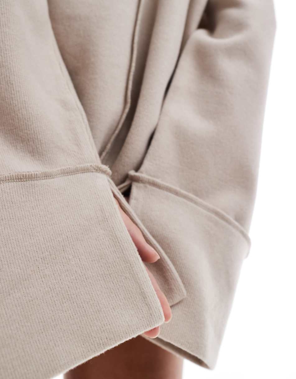 ASOS DESIGN supersoft exposed seam sweatshirt with deep cuffs in warm cream