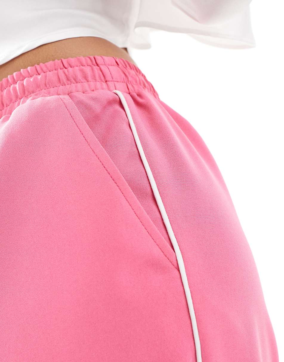 ASOS DESIGN tailored pull on pant with piping in pink