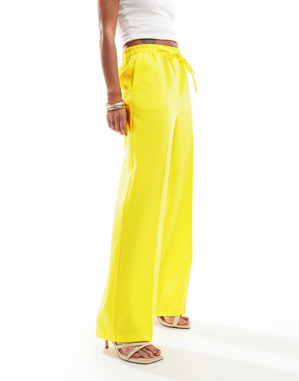 ASOS DESIGN tailored pull on pants in yellow