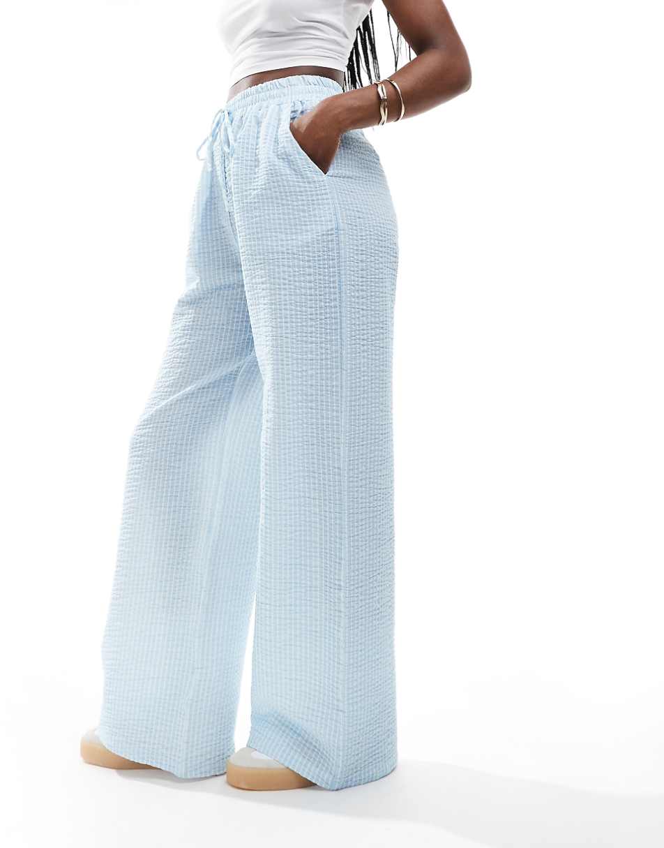ASOS DESIGN seersucker tie waist wide leg pants in blue & white stripe