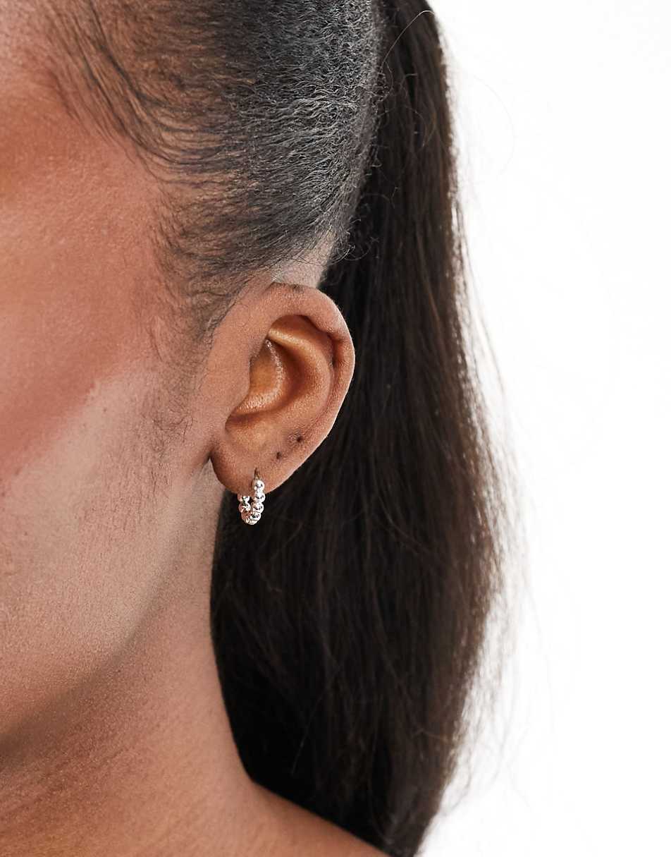 ASOS DESIGN silver plated huggie hoop earrings with ball detail