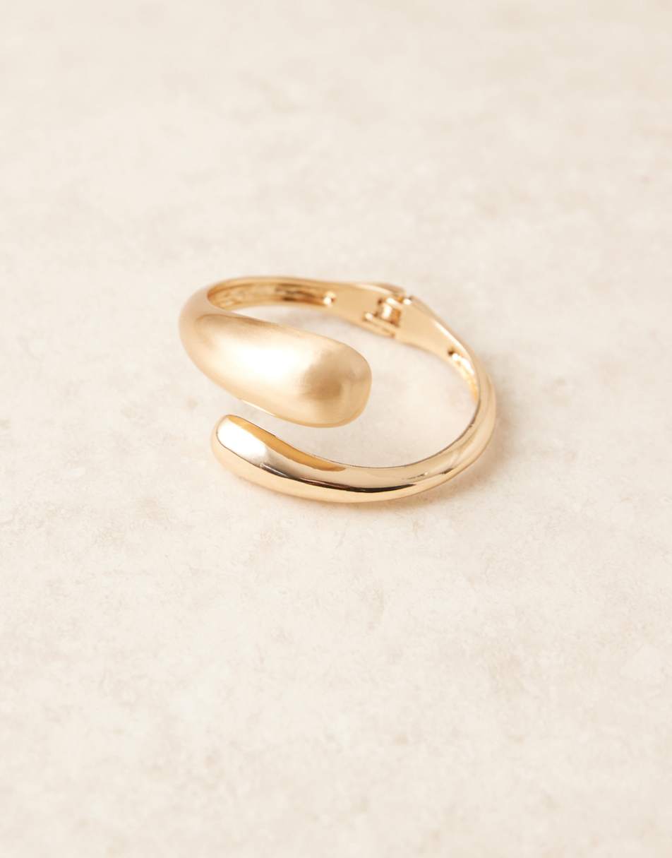 ASOS DESIGN cuff bracelet with wrap around molten detail with shiny and brushed gold tone