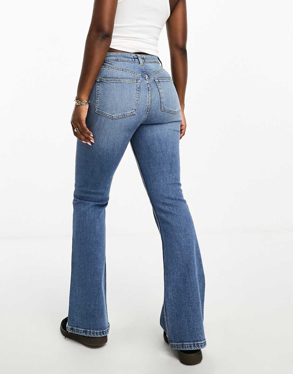 ASOS DESIGN Hourglass flared jeans in mid blue