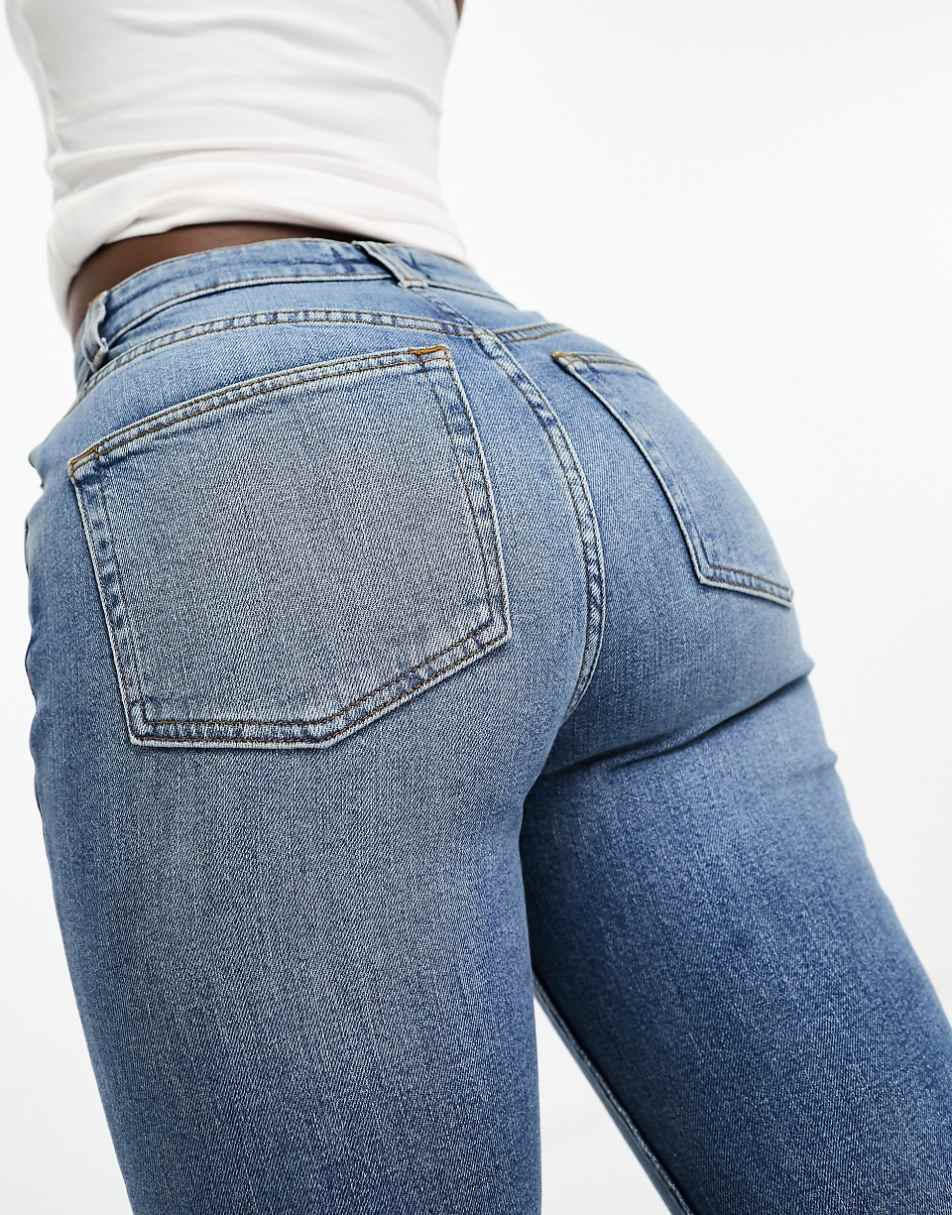 ASOS DESIGN Hourglass flared jeans in mid blue