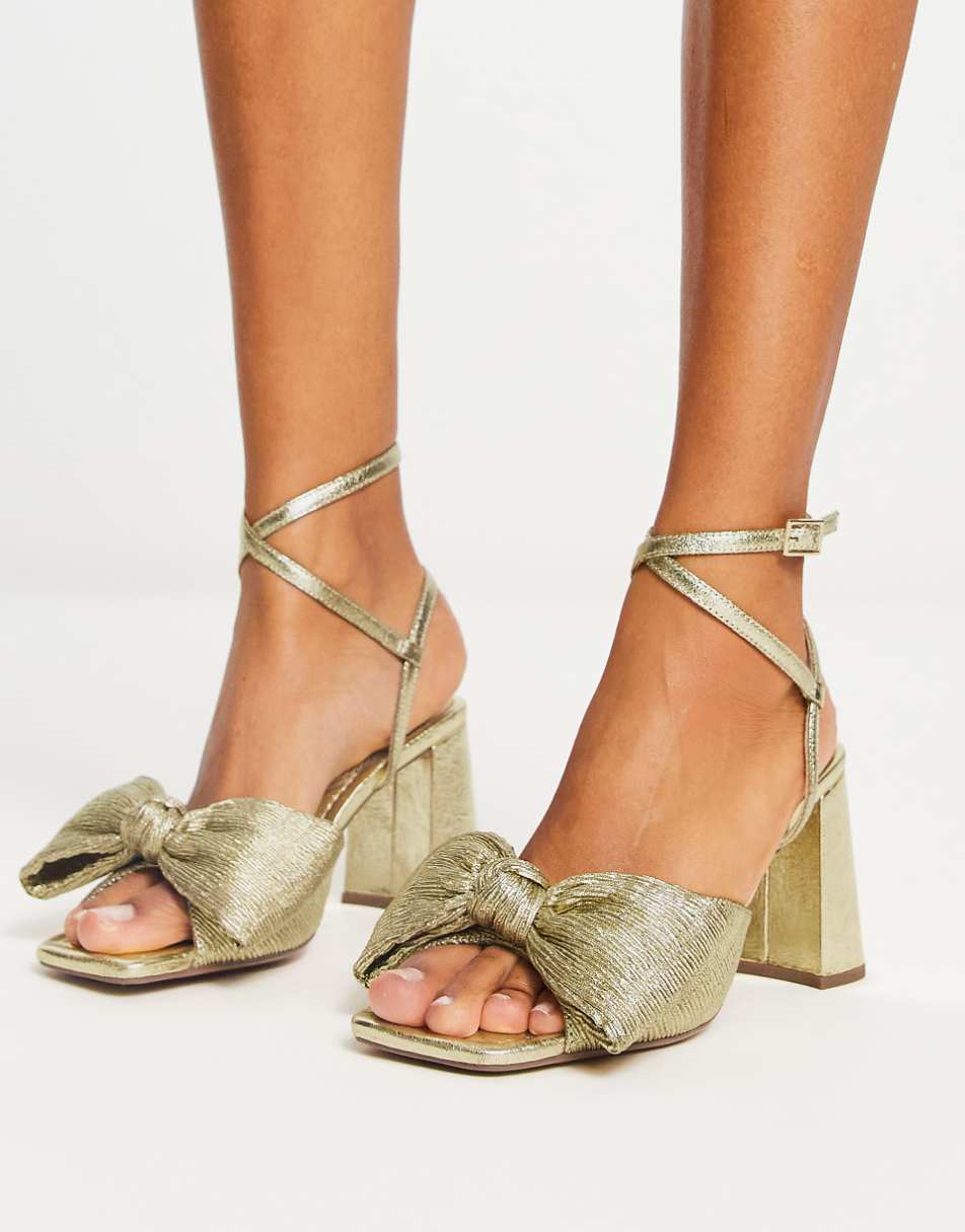 ASOS DESIGN Hitched bow detail mid block heeled sandals in gold