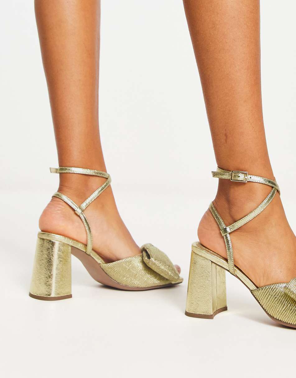 ASOS DESIGN Hitched bow detail mid block heeled sandals in gold