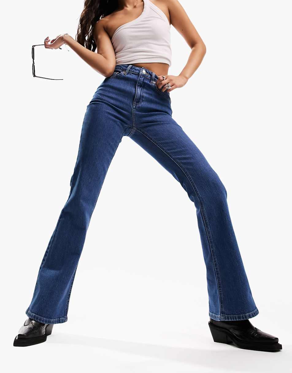 ASOS DESIGN flared jeans in mid blue