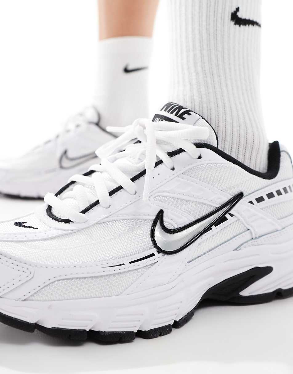 Nike Initiator sneakers in white and silver