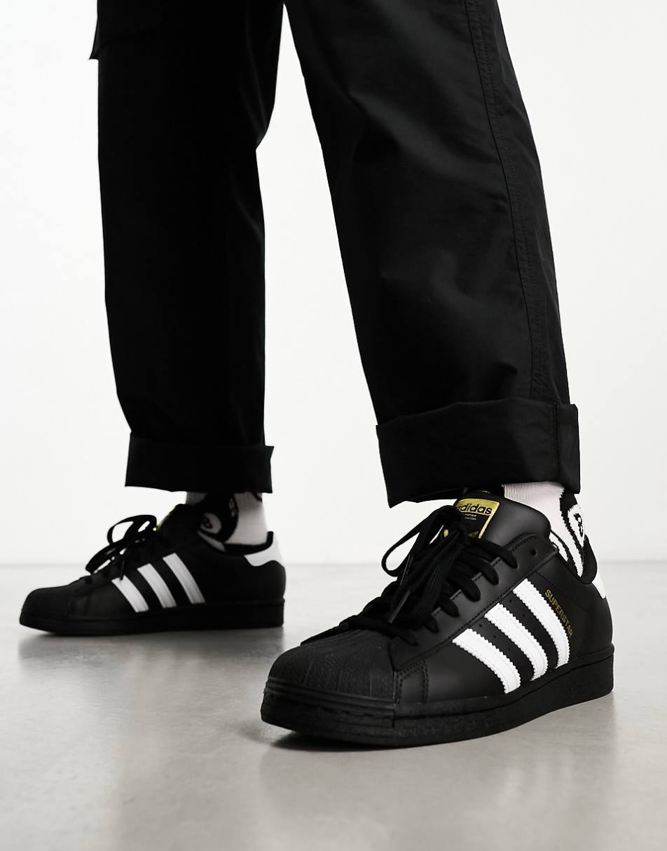 adidas Originals Superstar sneakers in black and white