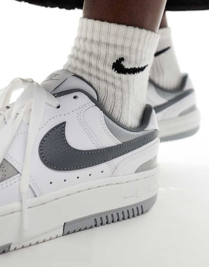 Nike Gamma Force sneakers in white and gray