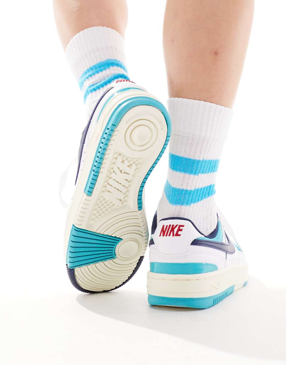 Nike Gamma Force sneakers in white and blue