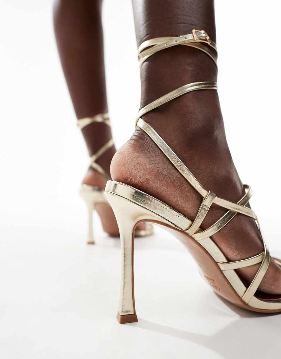 ASOS DESIGN Native strappy heeled sandals in gold