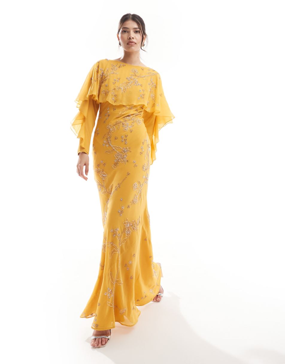 ASOS DESIGN Modesty embellished long sleeve ruffle bias maxi dress with cape detail in mustard