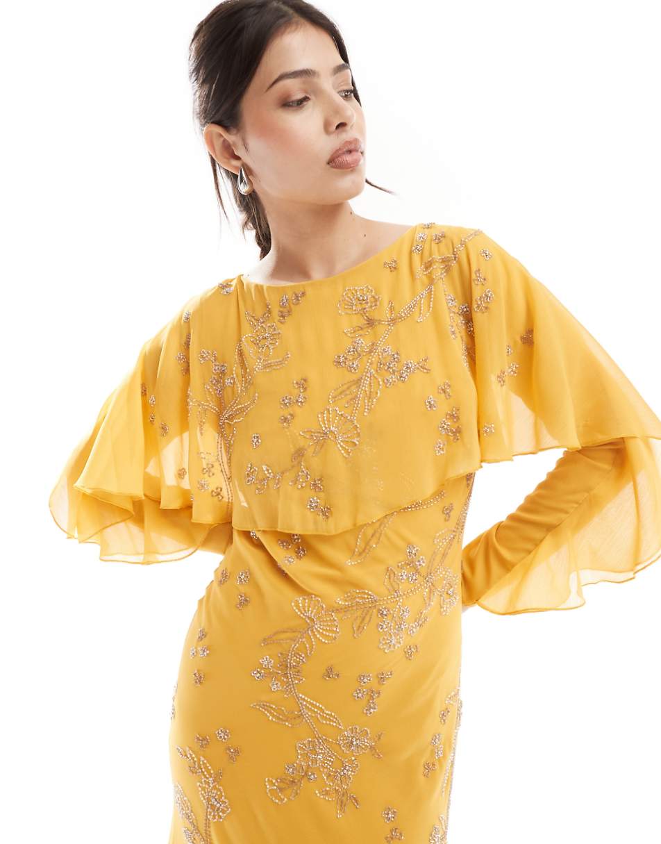 ASOS DESIGN Modesty embellished long sleeve ruffle bias maxi dress with cape detail in mustard