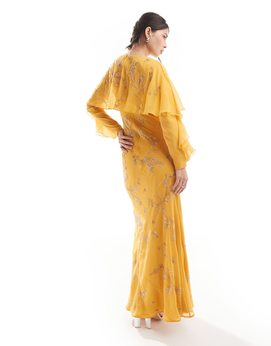 ASOS DESIGN Modesty embellished long sleeve ruffle bias maxi dress with cape detail in mustard