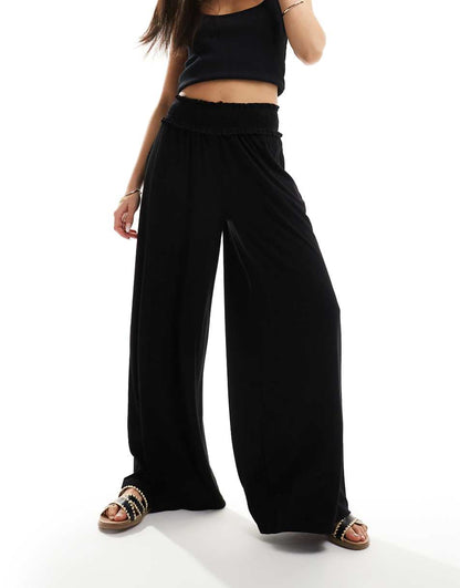 ASOS DESIGN shirred waist wide leg pants in black