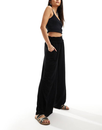 ASOS DESIGN shirred waist wide leg pants in black