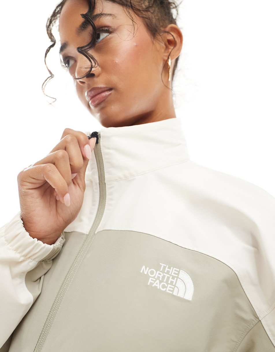 The North Face Easy Wind track jacket in cream and sage green