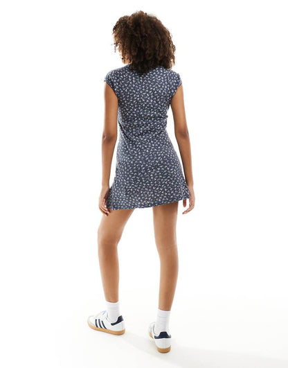 ASOS DESIGN scoop neck pointelle mini dress with bow detail in washed navy ditsy print