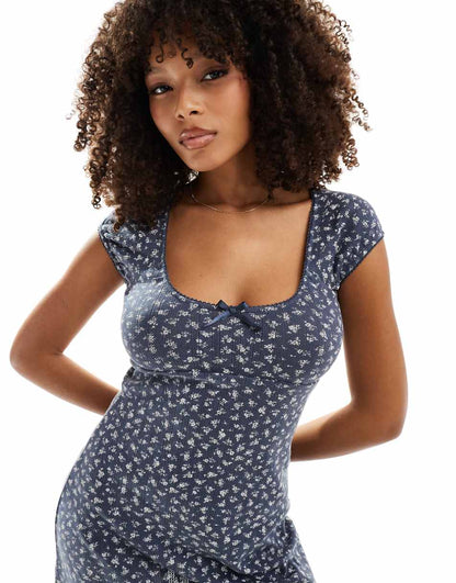 ASOS DESIGN scoop neck pointelle mini dress with bow detail in washed navy ditsy print