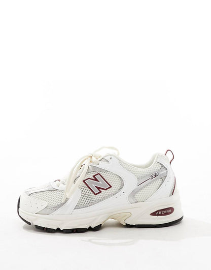 New Balance 530 sneakers in white with red and gray details