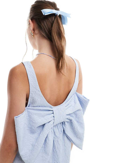 ASOS DESIGN textured scoop neck mini dress with big back bow detail in icy blue