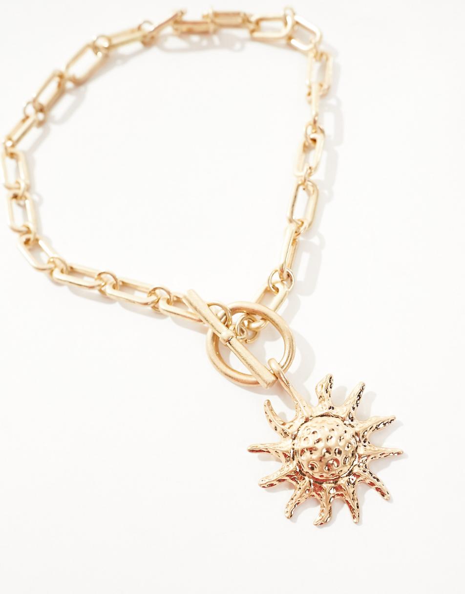 ASOS DESIGN necklace with tbar and sun charm detail in gold tone