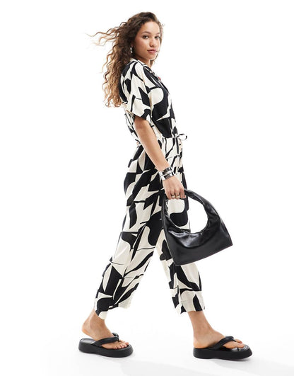 Monki tie waist jumpsuit in black and white puzzle print