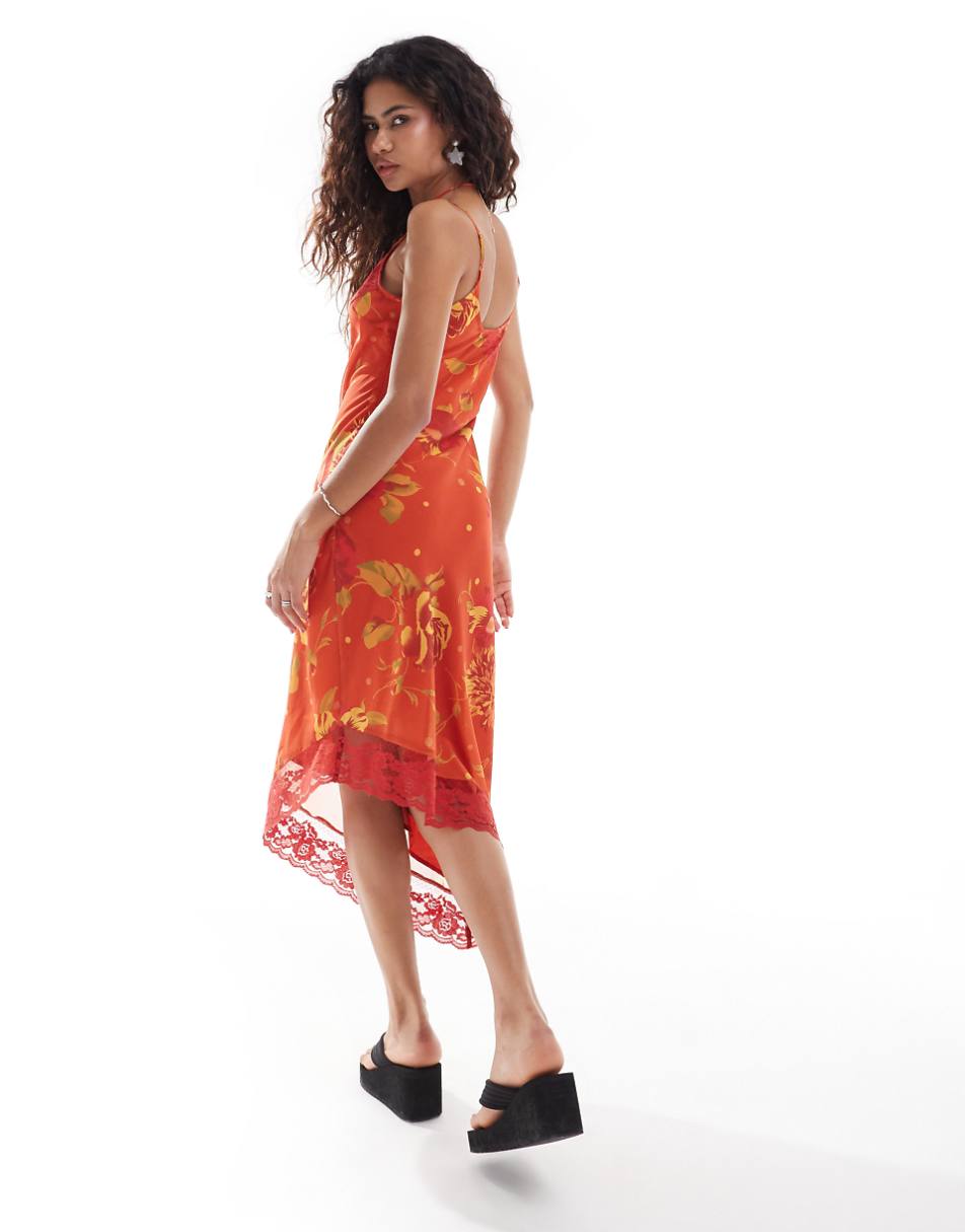 Reclaimed Vintage asymmetric hem cami midi slip dress in orange floral print