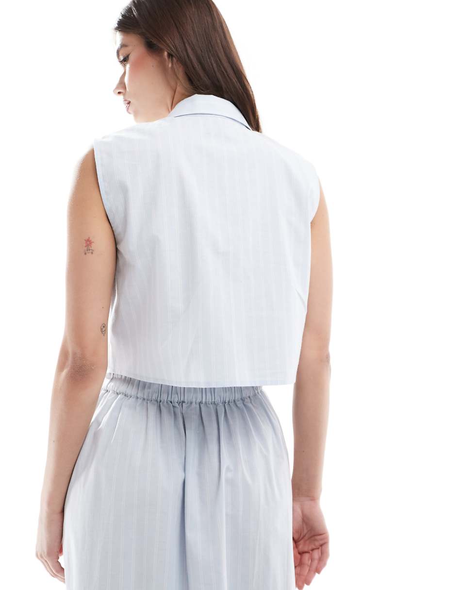 ASOS DESIGN sleeveless cropped shirt in blue and white stripe